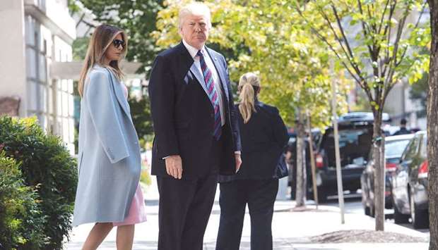 President Donald Trump and First Lady Melania Trump walk out of St Johnu2019s Episcopal Church in Washington, DC, yesterday after attending a service on the National Day of Prayer for victims of Hurricane Harvey which he proclaimed earlier this week.