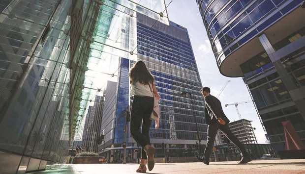 Pedestrians pass 30 Churchill Place (centre), which houses the European Medicines Agency, in the Canary Wharf financial, business and shopping district in London. Under UK laws, a company can only be charged if prosecutors can demonstrate senior executives u2013 or the so-called controlling mind u2013 of a company were involved.
