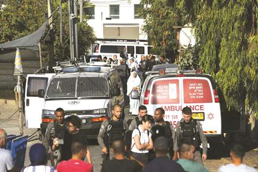 Israeli policemen stand guard as they evict the Palestinian Shamasneh family from their home.