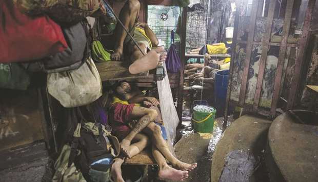 Inmates sleeping during a rainy night inside the Quezon City jail.