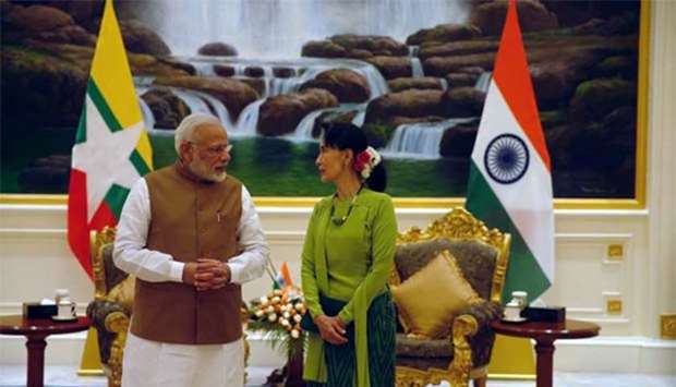Prime Minister Narendra Modi and Myanmar's State Counsellor Aung San Suu Kyi talk before their meeting in Naypyitaw on Wednesday.