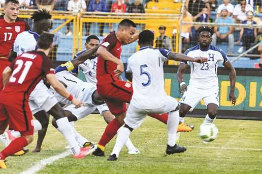 USAu2019s Bobby Wood (third from right) scores against Honduras during their 2018 World Cup football qualifier in San Pedro Sula, Honduras, on Tuesday. (AFP)