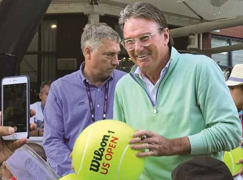 Tennis legend Jimmy Connors collects donations for Hurricane Harvey relief efforts at the US Open in New York. (Reuters)