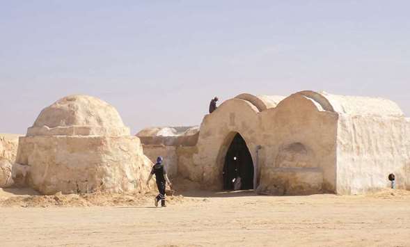 Restoration workers on an old Star Wars set in southern Tunisia.