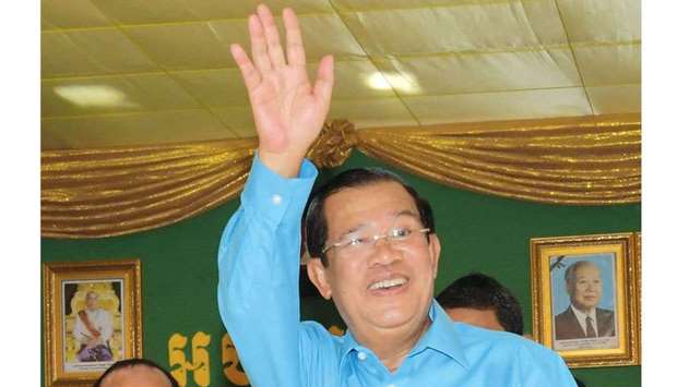 Cambodiau2019s Prime Minister Hun Sen greets workers during a ceremony at a compound of factories in Phnom Penh.