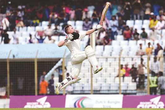 Australiau2019s David Warner celebrates his century on third day of the second Test against Bangladesh in Chittagong yesterday. (AFP)