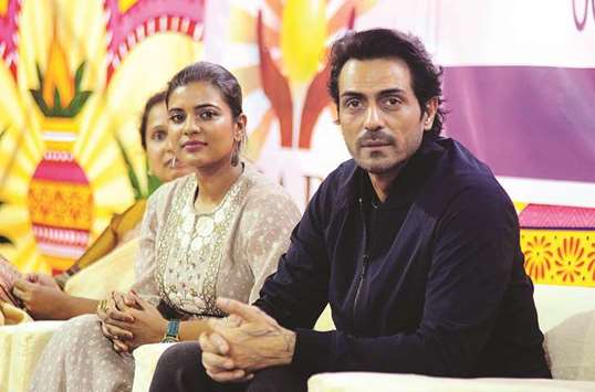 This file photo taken on August 4 shows Bollywood actors Arjun Rampal and Aishwarya Rajesh take part in a promotional event for the political crime drama Daddy in Mumbai.