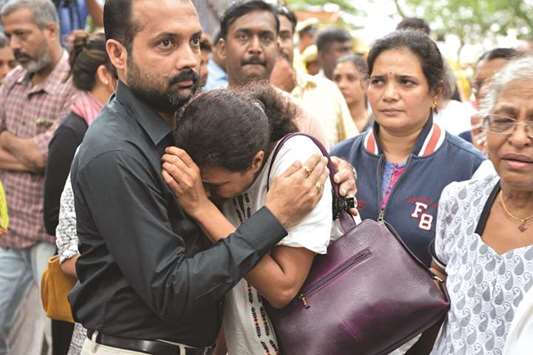 Gauri Lankeshu2019s sister Kavitha is consoled by a relative as the journalistu2019s body is brought to the Ravindra Kalakshetra cultural centre in Bengaluru yesterday.