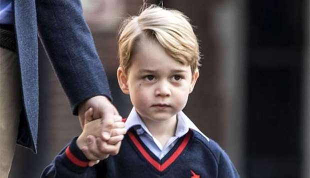 Prince George arrives for his first day of school at Thomas's school in Battersea, southwest London on Thursday.