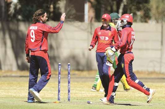 Jersey players celebrate a wicket during their match against Qatar yesterday. Jersey will now face Vanuatu in the ICC World Cricket League Division 5 final tomorrow. (Twitter/ICC)