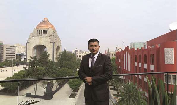 Concha, founder of New Beginnings, on the roof of the building housing the groupu2019s offices. The Monument to the Revolution can be seen in the background.