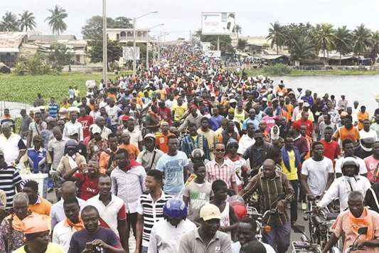 Protesters march yesterday during an anti-government demonstration in Lome led by a coalition of opposition parties.