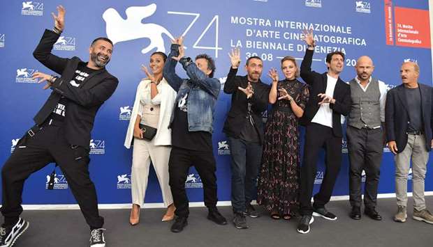 Actors (from left) Luca Tommassini, Serena Rossi, directors Marco Manetti and Antonio Manetti, actors Claudia Gerini, Giampaolo Morelli, Raiz and Carlo Buccirosso strike poses inspired by Michael Jacksonu2019s Thriller music video during the photocall of the movie Ammore e Malavita (Love and Bullets)  presented in competition at the 74th Venice Film Festival. The movie Michael Jacksonu2019s Thriller 3D and making of Michael Jacksonu2019s Thriller was presented out of competition at the festival on September 4.