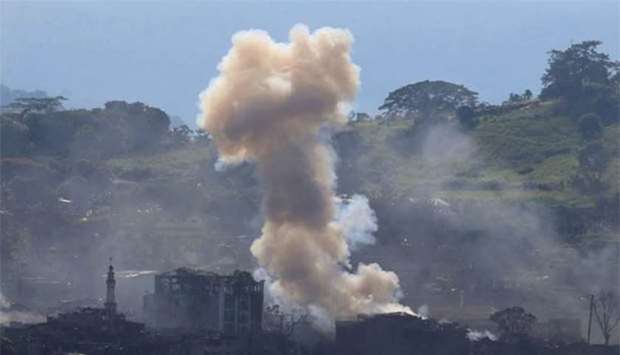Smoke billows from burning buildings, as government troops continue their assault against pro-IS militants which seized control of large parts of Marawi city, southern Philippines, on Thursday.
