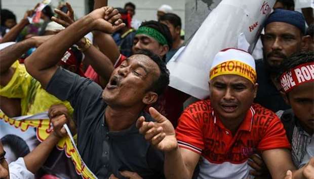 Rohingya refugees living in Malaysia react during a protest against the treatment of Rohingya Muslims in Myanmar, in Kuala Lumpur on Friday.