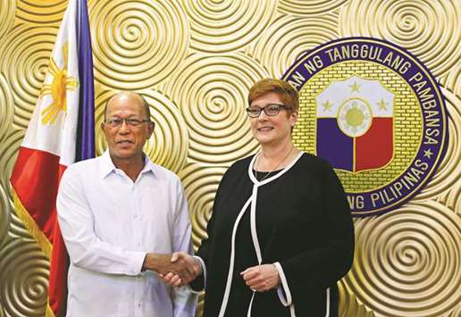 Australian Defence Minister Marise Payne shakes hands with her Filipino counterpart Delfin Lorenzana, before their meeting to discuss military strategy and assistance in the Philippinesu2019 fight against militants in Marawi, at Villamor Air Base in Pasay, Metro Manila, yesterday.