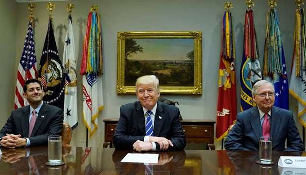 US President Donald Trump meets with Speaker of the House Paul Ryan (R) and Senate Majority Leader Mitch McConnell