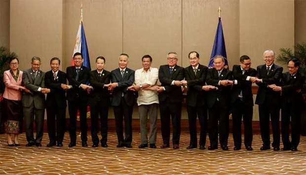 Philippines President Duterte links arms with ASEAN Economic Ministers