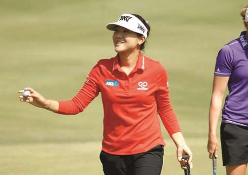 Lydia Ko of New Zealand waves to the crowd after making a birdie on the fifth hole during the second round of the Indy Women In Tech Championship at the Brickyard Crossing Golf Course in Indianapolis, Indiana, on Friday. (AFP)