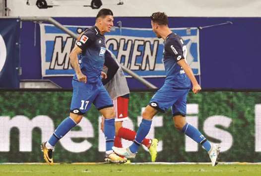 Hoffenheimu2019s Mark Uth celebrates scoring their second goal with Steven Zuber yesterday. (Reuters)