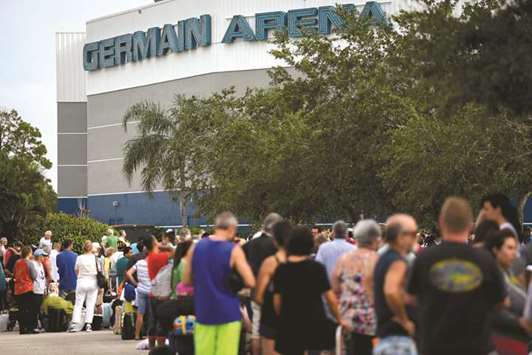 Residents line up outside for shelter in the Germain Arena in preparation for Hurricane Irma in Estero, Florida.