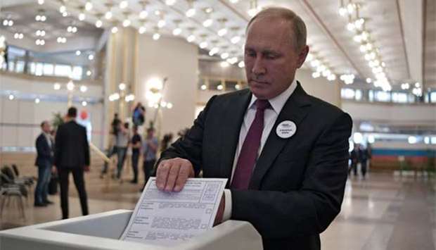 President Vladimir Putin casts his ballot during mayoral election in Moscow, on Sunday.