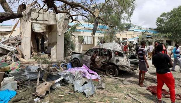 A destroyed car is seen at the scene of an explosion in Hodan district, Mogadishu on Monday.