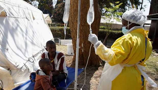 Patients await treatment at a makeshift cholera clinic in Harare, Zimbabwe