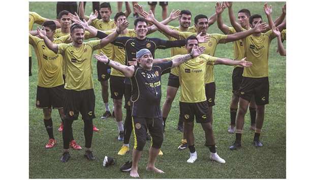 Argentine legend Diego Maradona (centre) gestures with the players during his first training session as coach of Mexican football club Dorados, at the Banorte stadium in Culiacan, Sinaloa State, Mexico, on Monday. (AFP)