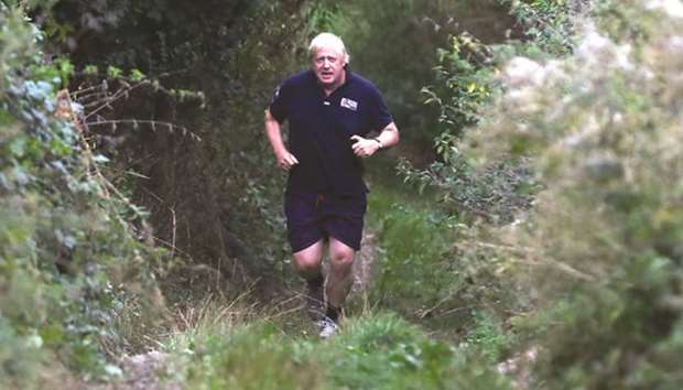 Former foreign secretary Boris Johnson jogs near his home in Oxfordshire yesterday.