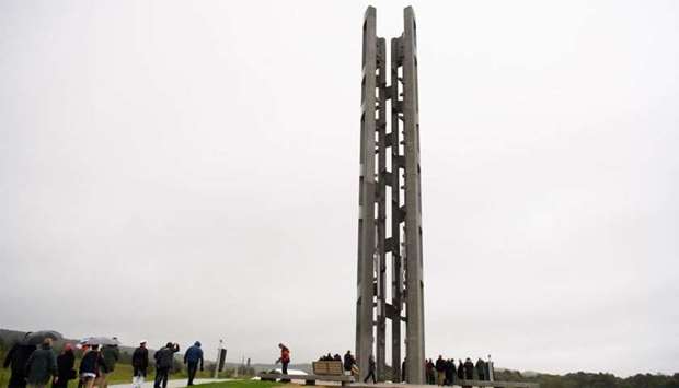 The Tower of Voices stands above visitors, dignitaries and family members of the victims of Flight 93 at the Flight 93 National Memorial in Shanksville, Pennsylvania