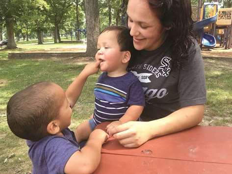 ALLu2019S WELL THAT ENDS WELL: Nicholas Ortiz enjoys an afternoon at Phillips Park with his 2-year-old brother Ethan and mom Reyna after a choking scare a few days earlier.