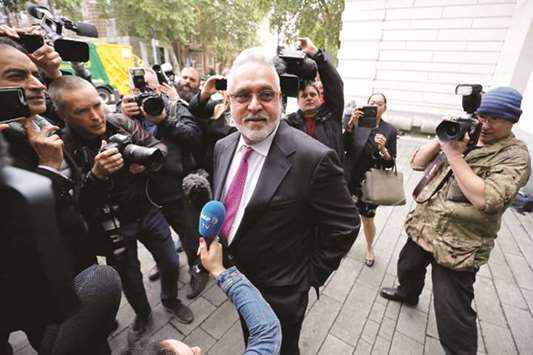 Vijay Mallya speaks to members of the media as he arrives to appear at Westminster Magistrates Court in central London yesterday to attend the closing arguments in his extradition hearing.