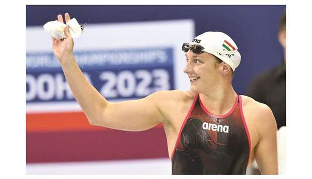 Hungaryu2019s Katinka Hosszu waves after winning the 400m freestyle on the opening night of the FINA Swimming World Cup at the Hamad Aquatic Centre. At right,  Netherlandsu2019 Kira Toussaint (left) celebrates after winning the 50m backstroke with her compatriot Ranomi Kromowidjojo, who came second. PICTURES: Noushad Thekkayil