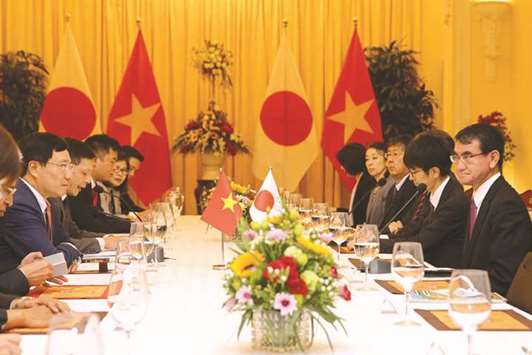 Japanu2019s Foreign Minister Taro Kono and his Vietnamu2019s counterpart Pham Binh Minh meet at the Government Guest House in Hanoi yesterday. Japan and Vietnam yesterday urged the United States to rejoin a sprawling Pacific trade deal, almost two years after President Donald Trumpu2019s withdrawal dealt a major blow to what would have been the worldu2019s largest free trade pact.