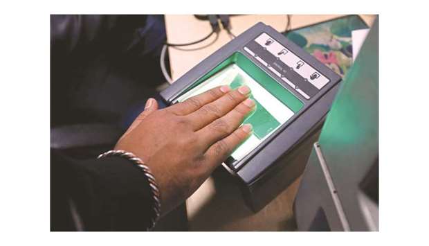 A woman goes through the process of finger scanning for the Unique Identification (UID) database system, also known as Aadhaar, at a registration centre in New Delhi.
