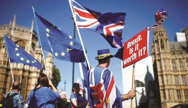 Pro-EU demonstrators protest outside parliament in Westminster London, yesterday.