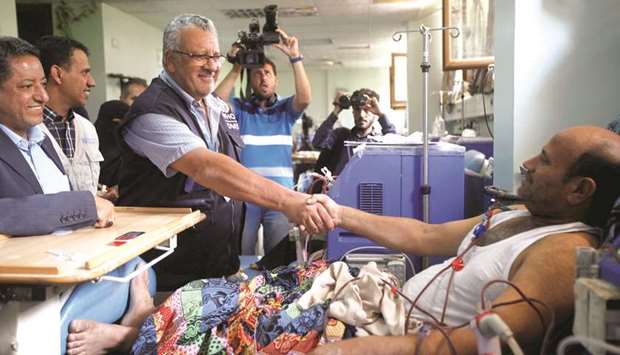 The WHO Representative in Yemen Dr Nevio Zagaria shakes hands with a patient during his visit Hemodialysis Center at Al Thawra hospital in Sanaa.