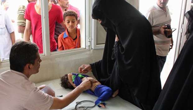 A Yemeni child is checked at a hospital in the northern district of Abs, in Yemen's Hajjah province on September 8, 2018.