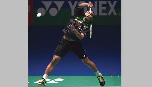 Thailandu2019s Khosit Phetpradab hits a smash during his win over Chinau2019s Chen Long in the quarter-finals of the Japan Open. (AFP)