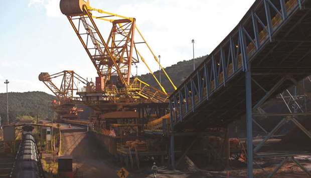 Crushed iron ore fills cargo train wagons aside a conveyor belt at Valeu2019s iron ore Brucutu mine in Barao dos Cocais, Brazil (file). Iron oreu2019s been becalmed, but beneath the surface the global market is in a state of tremendous flux.
