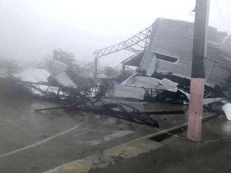 A damaged building is seen as the typhoon hit Philippines, in Laoag.
