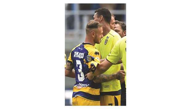Parmau2019s Federico Dimarco (left) celebrates with teammates after their Serie A win over Inter Milan yesterday. (AFP)