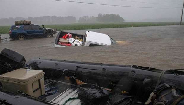 A pickup truck is seen submerged in floodwater in Lumberton, North Carolina