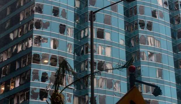 A general view shows windows of a commercial building smashed during Super Typhoon Mangkhut in Hong Kong