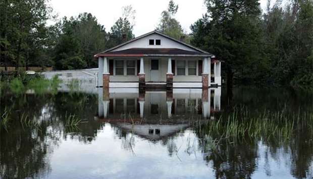 A house is surrounded by floodwaters from the Neuse River in Kinston, North Carolina.