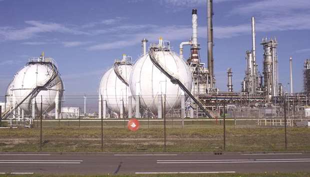 Gasoline storage tanks stand at the Q8 Europort refinery, operated by Kuwait Petroleum Corp, in Rotterdam, Netherlands (file). Fitch Solutions team forecasts Brent to average $75 a barrel this year and $80/b in 2019, up from $54.8/b in 2017, which will support confidence in the economy, and enable governments to move away from austerity.