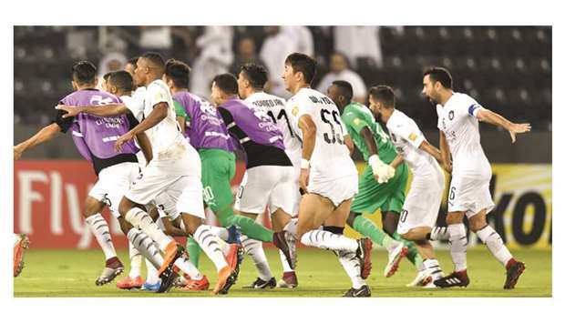 Al Sadd players, with Xavi on extreme right, celebrate their qualification to the AFC Champions League semi-finals yesterday.  PICTURES:  Noushad Thekkayil and Agencies