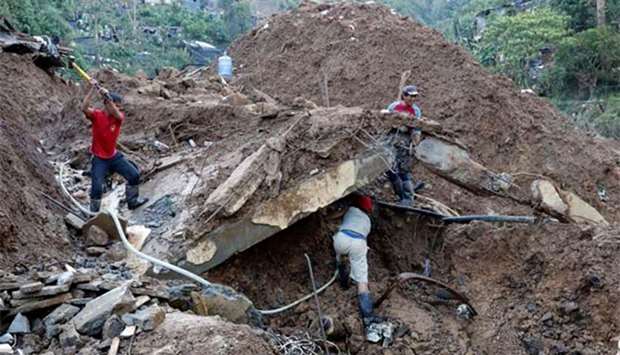 Rescuers continue their search for missing miners in a landslide caused by Typhoon Mangkhut in Itogon on Tuesday.