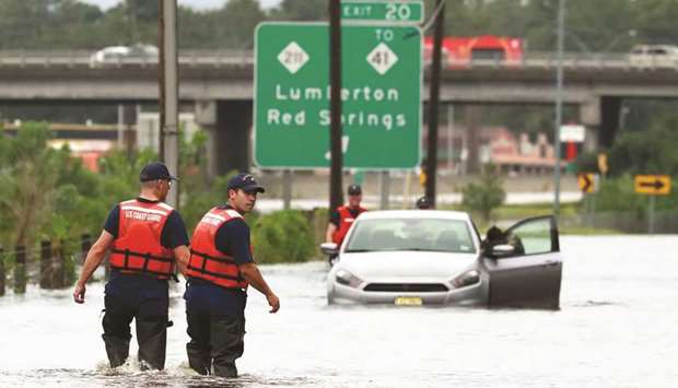 Members of the Coast Guard help a stranded motorist in Lumberton, North Carolina.